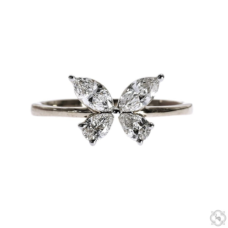 White gold butterfly ring with four marquise-cut diamonds forming butterfly wings