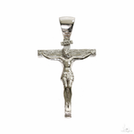 Small silver crucifix pendant with detailed Jesus figure and INRI plaque.