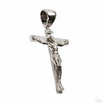 Small silver crucifix pendant with detailed Jesus figure and INRI plaque at the top.