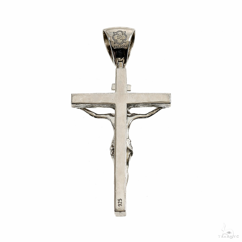 Small silver crucifix pendant with detailed Jesus figure and polished finish.