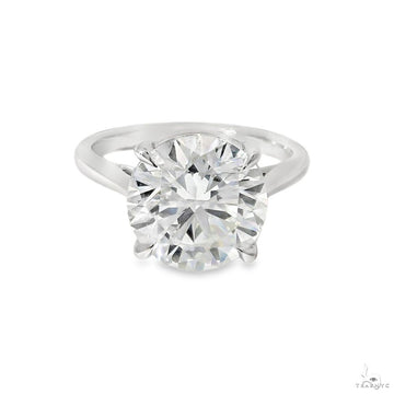 Round brilliant solitaire diamond engagement ring on polished band – face-up center stone view