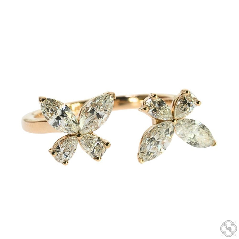 Women's butterfly diamond ring in 14k gold — marquise-cut stones arranged in open wing silhouette, top-down view