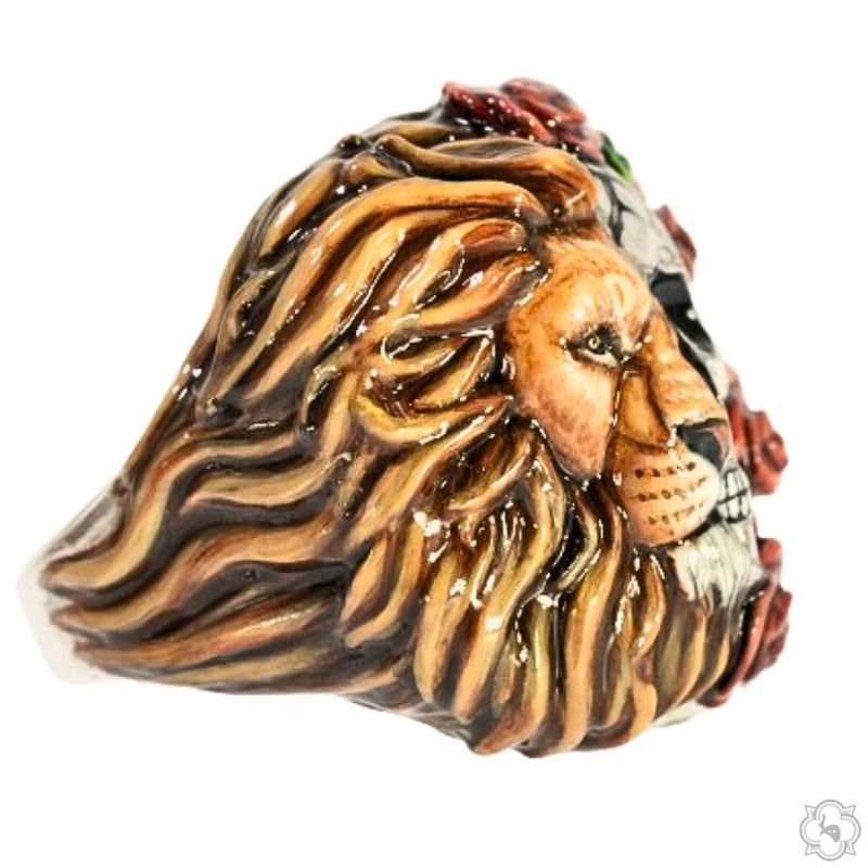 Silver ring with half lion face and half skull adorned with red roses and green leaves