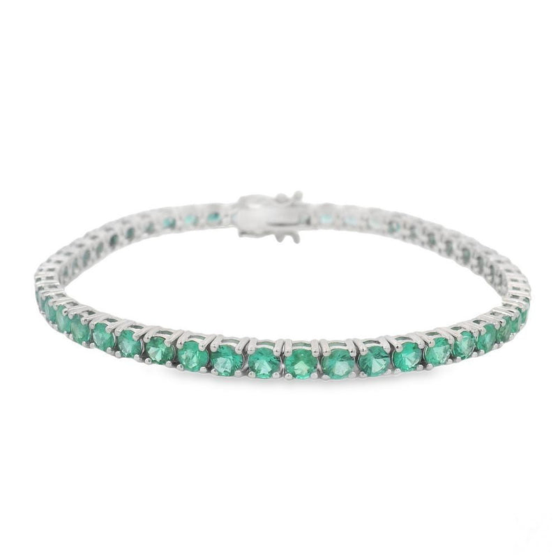 White gold tennis bracelet with round emerald gemstones in a single row