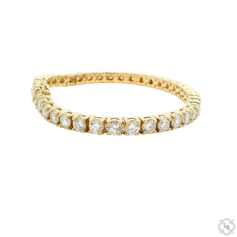 Yellow gold tennis bracelet with round lab diamonds and secure clasp closure