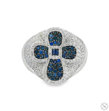 White gold men's ring with blue sapphire and surrounding white diamonds in cross design.