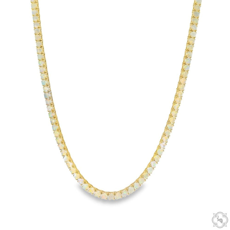 Gold tennis chain necklace with small rectangular opal gemstones, unisex design
