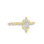 1 Ct marquise diamond engagement ring with gold band and round side stones.