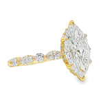 2 ct marquise diamond engagement ring with gold band and round diamond accents.