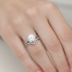 White gold wishbone wedding band with small diamonds in a curved design.
