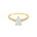 Pear-shaped diamond engagement ring in yellow gold with detailed band accents.