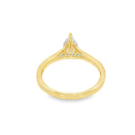 Pear-shaped diamond engagement ring in yellow gold with detailed band accents.