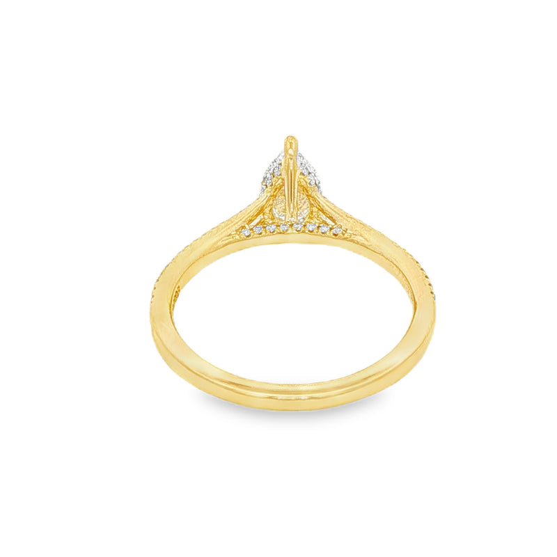 Pear-shaped diamond engagement ring in yellow gold with detailed band accents.
