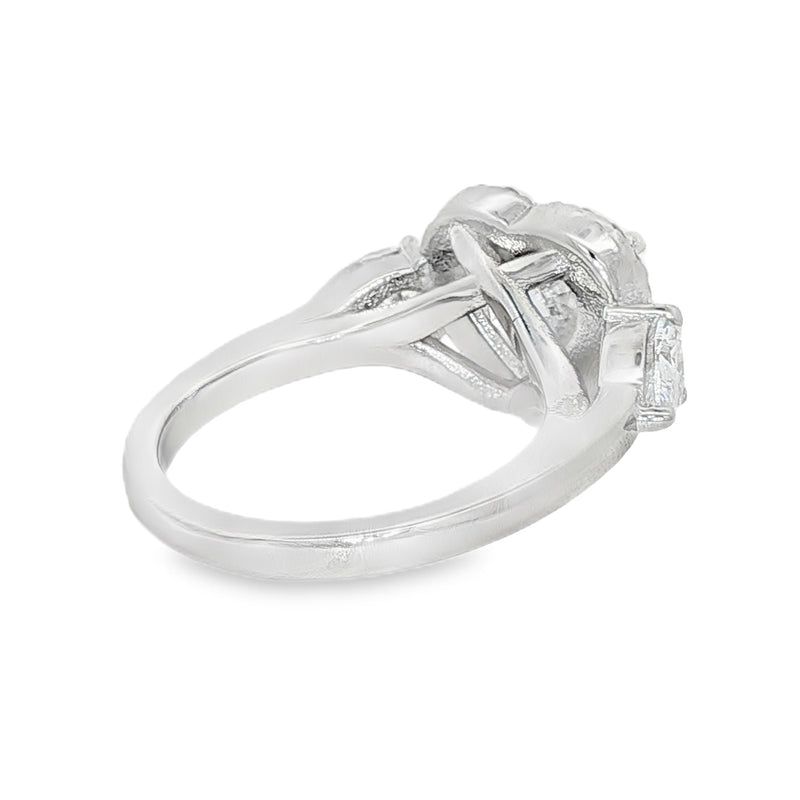 White gold heart-shaped halo three-stone diamond engagement ring, elegant design.