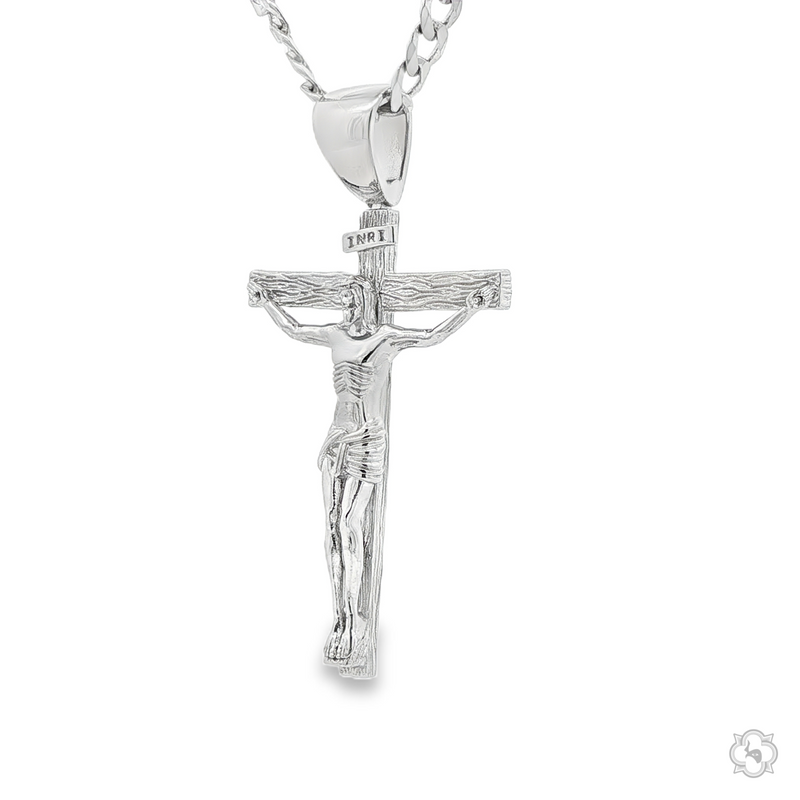 Silver Jesus crucifix pendant with detailed figure on Cuban curb chain, 22-inch length.