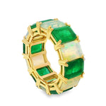 Yellow gold eternity ring with alternating emerald and opal rectangular stones.