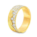 Wide gold wedding band with textured finish and two rows of sparkling round diamonds.