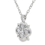 Silver pendant shaped like a clover with sparkling round cubic zirconia stones on a chain.