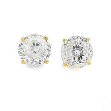 8 CT Portuguese diamond stud earrings set in yellow gold prongs.