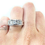 Men's white gold wedding band with channel-set round diamonds across the center.
