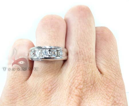 Men's white gold wedding band with channel-set round diamonds across the center.