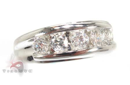 Men's white gold wedding band with channel-set round diamonds across the center.