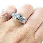 Men's white gold wedding band with channel-set round diamonds across the center.
