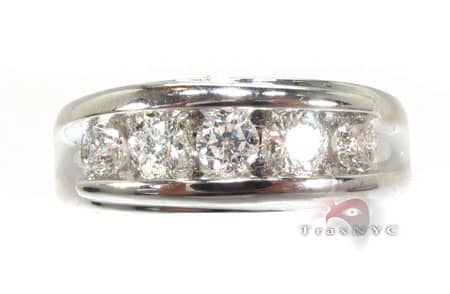 Men's white gold wedding band with channel-set round diamonds across the center.