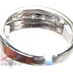 Men's white gold wedding band with channel-set round diamonds across the center.