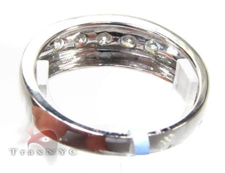 Men's white gold wedding band with channel-set round diamonds across the center.