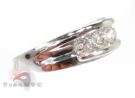Men's white gold wedding band with channel-set round diamonds across the center.