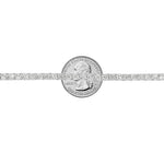 White gold tennis bracelet with alternating upside down round diamonds in a sleek setting.