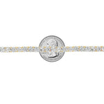 Yellow gold tennis bracelet with alternating upside-down round diamonds in secure clasp.
