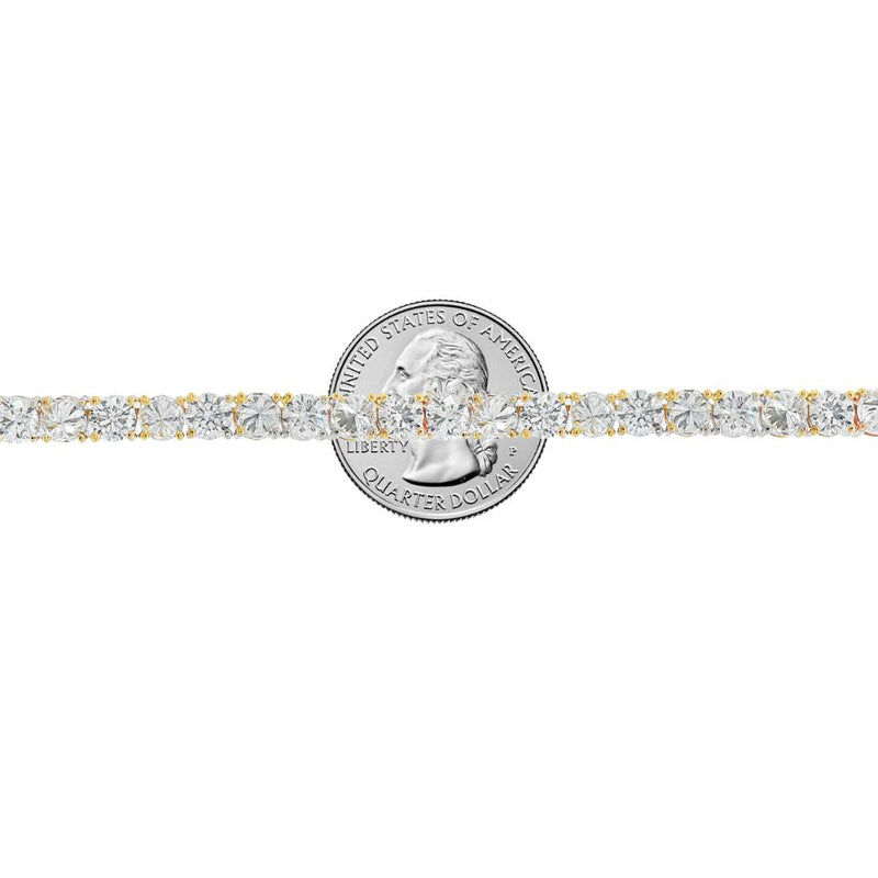 Yellow gold tennis bracelet with alternating upside-down round diamonds in secure clasp.