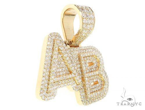 Yellow gold AB pendant covered in small sparkling diamonds with a diamond-encrusted bail