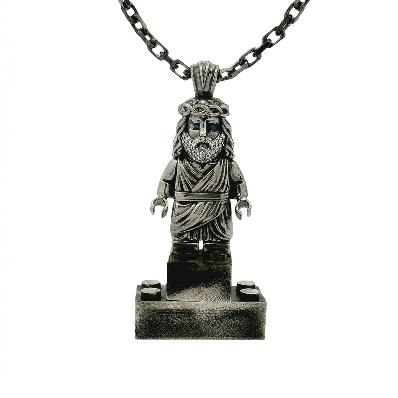 Silver TraxNYC Jesus pendant with blue diamond eyes on anchor cable chain.