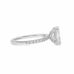 White gold engagement ring with round center diamond and small side diamonds on band.