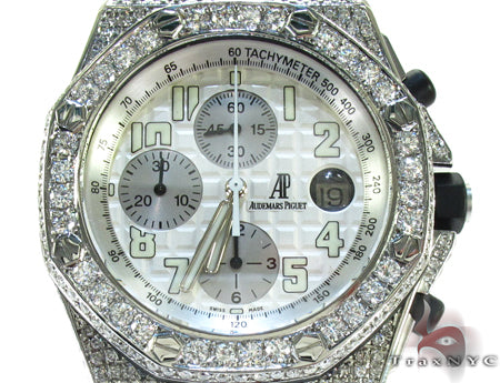 Audemars Piguet Royal Oak men's watch with diamond bezel and silver chronograph dial.