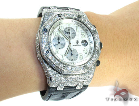 Audemars Piguet Royal Oak men's watch with diamond bezel and silver chronograph dial.