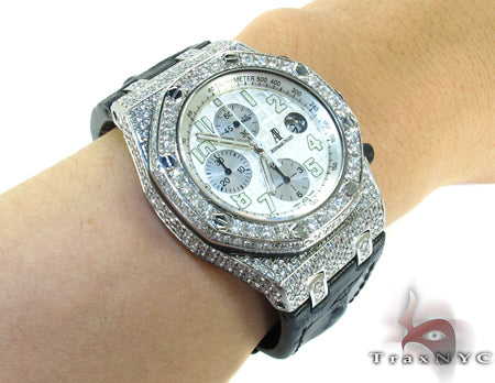Audemars Piguet Royal Oak men's watch with diamond bezel and silver chronograph dial.