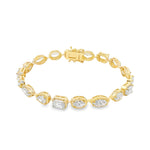 Yellow gold tennis bracelet featuring multi-shape sparkling diamonds in assorted cuts.