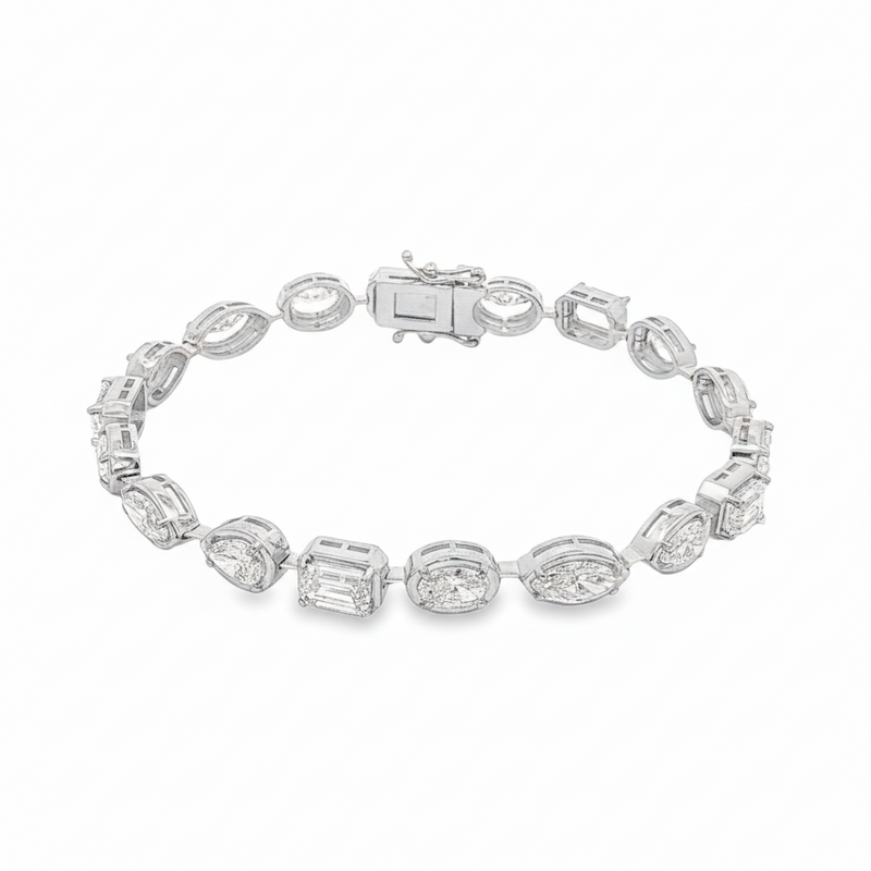 Yellow gold tennis bracelet featuring multi-shape sparkling diamonds in assorted cuts.