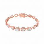 Yellow gold tennis bracelet featuring multi-shape sparkling diamonds in assorted cuts.