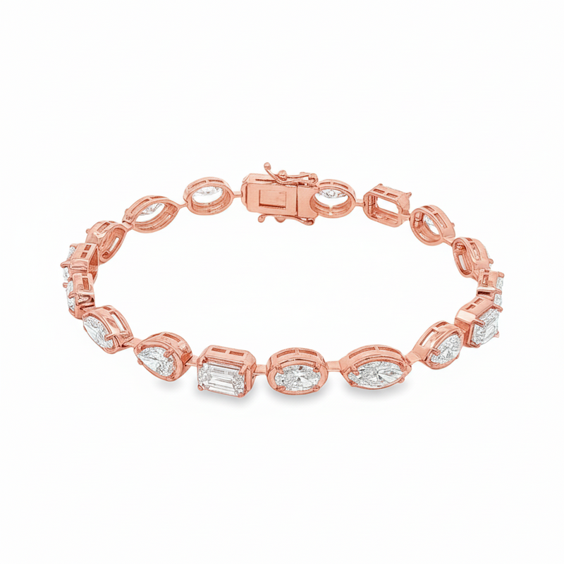 Yellow gold tennis bracelet featuring multi-shape sparkling diamonds in assorted cuts.