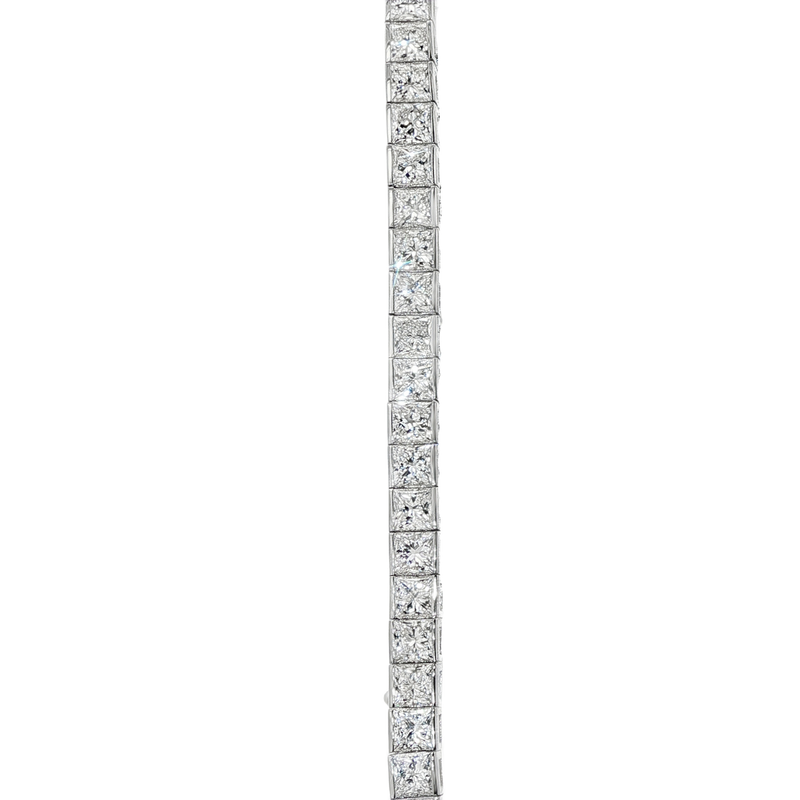 White gold diamond tennis bracelet with secure clasp, sleek and elegant design.
