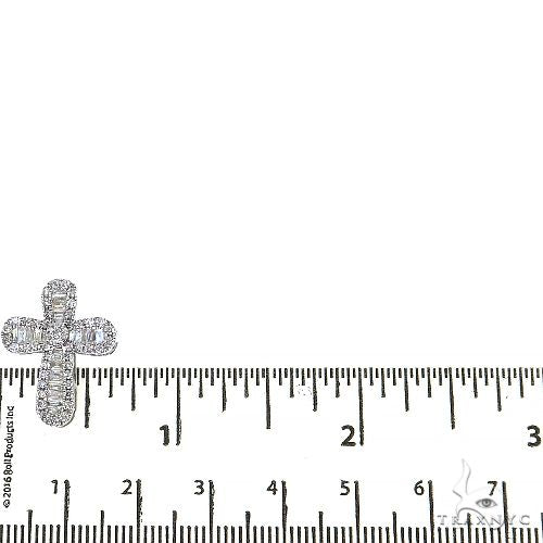White gold baguette diamond cross pendant with matching smaller cross charm on a chain