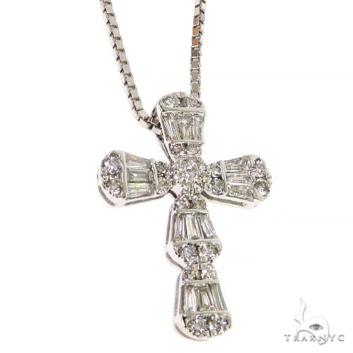 White gold baguette diamond cross pendant on a sleek chain with sparkling round accents