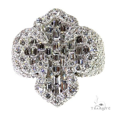 White gold baguette diamond cross ring with round diamond halo and detailed band.