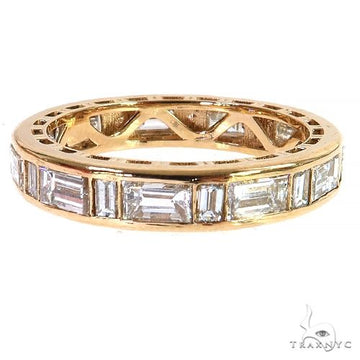 Rose gold band with baguette-cut diamonds encircling the ring in an eternity style.