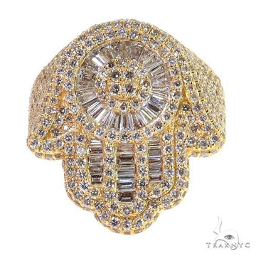 Yellow gold men's ring with baguette and round diamonds in intricate Hamsa design.